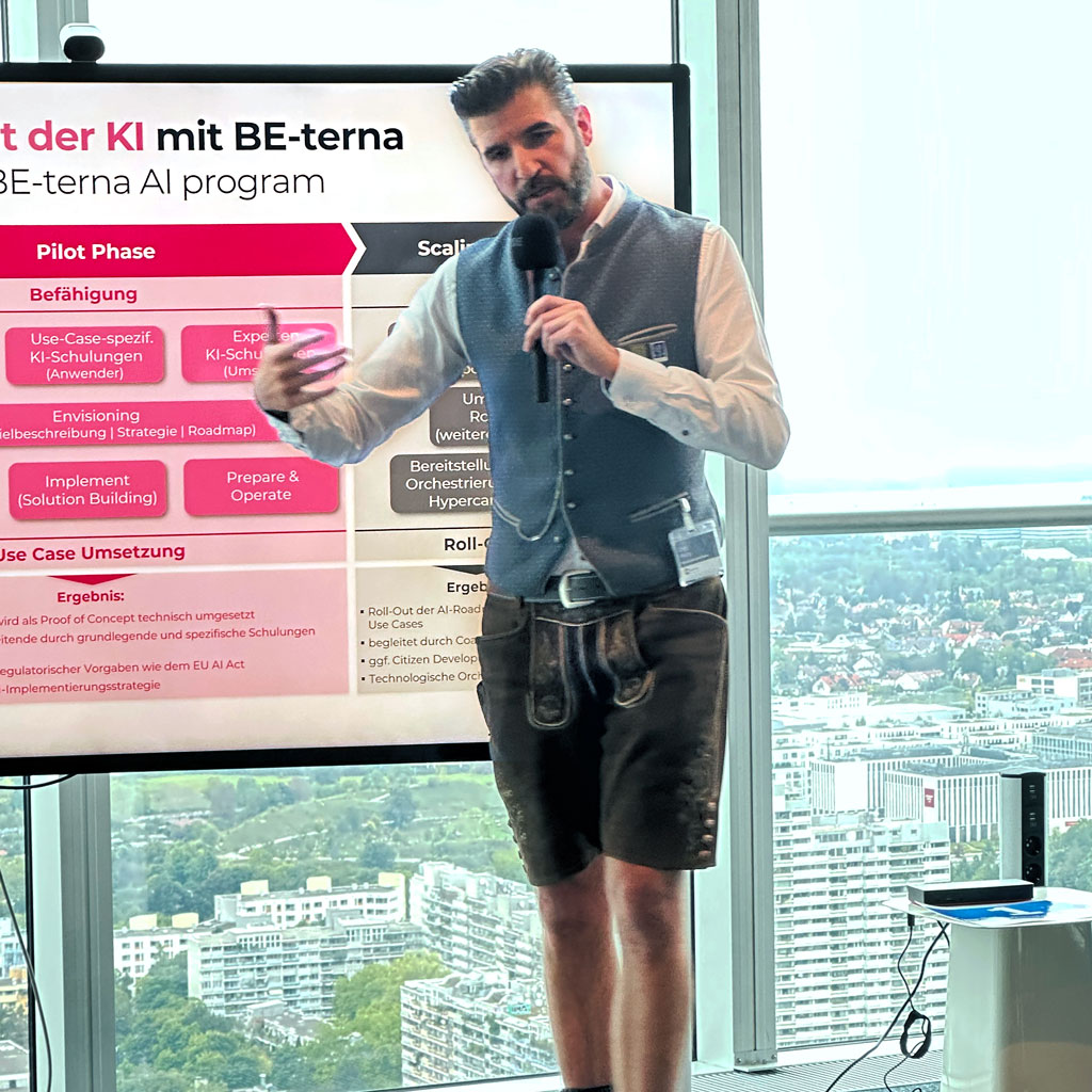 Chris Malloy von BE-terna präsentiert im o2 Tower München den 3-Phasen-Plan zur Einführung von Künstlicher Intelligenz bei Unternehmen.